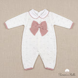 Tutina neonato bianca con grande fiocco rosa